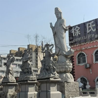 文化广场摆放青石雕刻关公佛像石狮子雕像