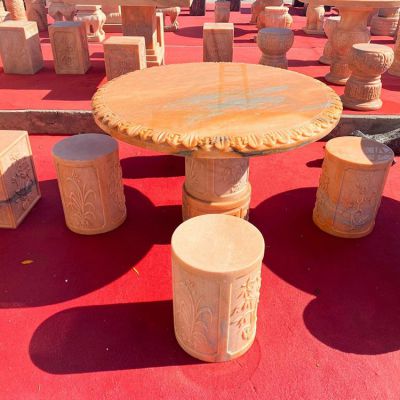 庭院摆放大理石晚霞红浮雕圆形石桌石凳