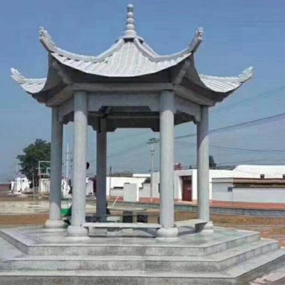 村庄文化中心摆放青石雕刻六角休闲凉亭