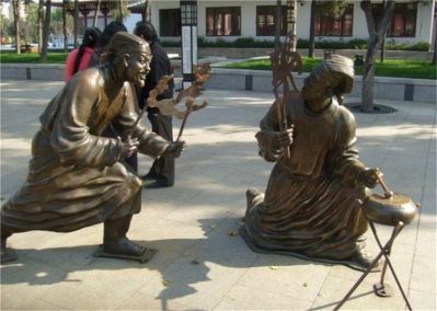 步行街玻璃钢仿铜表演皮影戏古人景观博鱼网页版