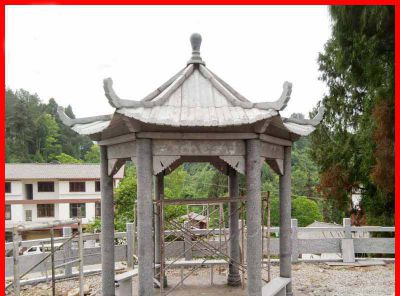 村庄河道边摆放砂岩六角仿古建凉亭