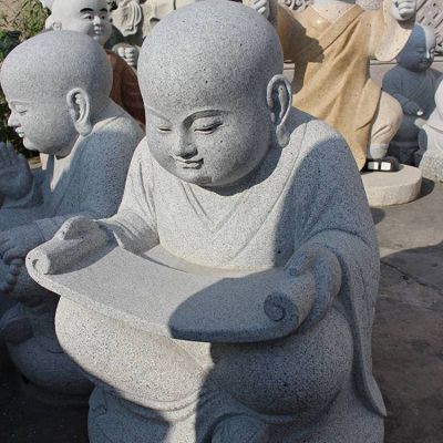 校园公园大理石石雕读书的小沙弥