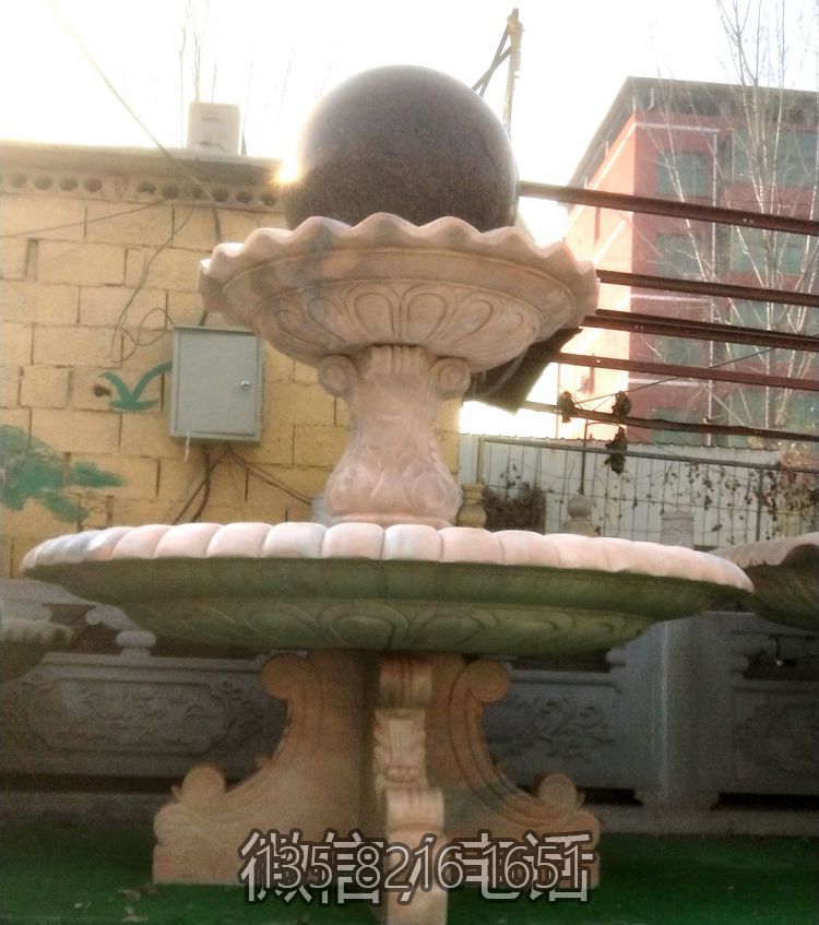 晚霞红石雕风水球喷泉